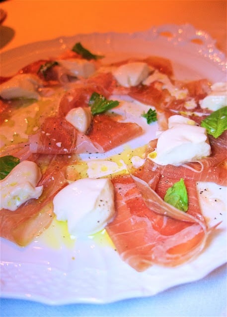 Prosciutto and Mozzarella appetizer. There were three types of prosciutto - sweet, smoky and salty. The mozzarella is made in-house. It was warm when they brought it to the table. They cut the mozzarella right at the table and place it on top of the prosciutto. SO GOOD! from Carbone at The Aria in Las Vegas