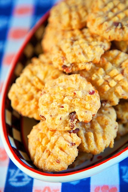 Cheddar Bacon Crackers - quick homemade bacon and cheddar cheese crackers. Use your food processor and the dough is ready in a minute! The recipe makes about 4 ½ dozen - perfect for a party! They are always the first thing to go!