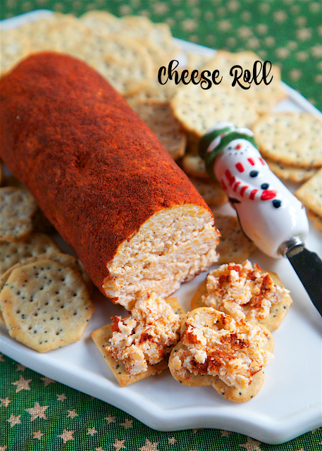 Cheese Roll recipe - cheddar cheese, cream cheese, dry mustard, hot sauce, garlic, mayonnaise and Worcestershire - mix together and roll in a mixture of chili powder and paprika. Great for parties! I am totally addicted to this cheese roll! I could literally eat the whole thing! Serve with crackers.