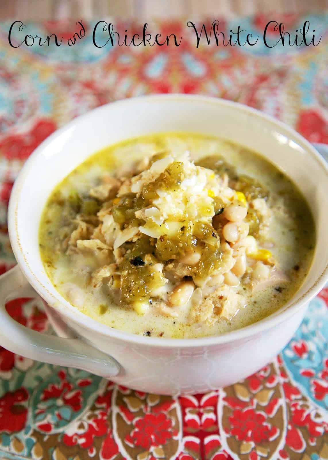Corn and Chicken White Chili Recipe - made in the slow cooker - dried northern beans, chicken, green chiles, corn, chicken broth, half-and-half, cumin - slow cooks all day. Serve with some crusty bread or cornbread for an easy weeknight meal!