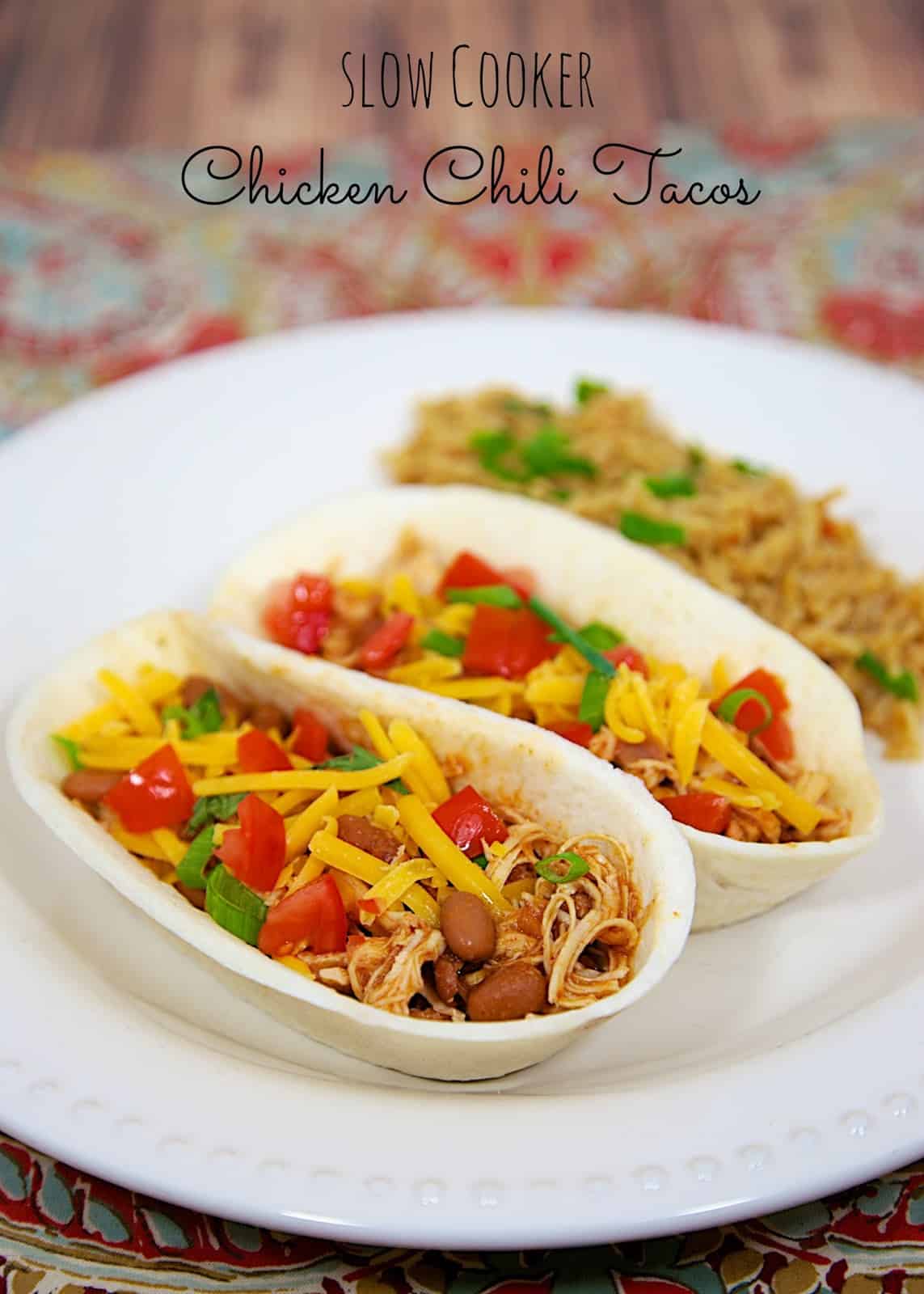 Slow Cooker Chicken Chili Tacos - only 3 ingredients! Great for tacos, topping a salad, or nachos. Makes a ton! Freeze leftovers for later. Everyone loves this easy Slow Cooker Mexican Chicken recipe!