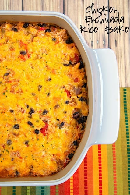 Chicken Enchilada Rice Bake Recipe - chicken, black beans, corn, Rotel tomatoes, cheese, rice and enchilada sauce! SO good! I wanted to eat the whole pan! Use rotisserie chicken and this is ready for the oven in 10 minutes. Super quick Mexican dinner recipe.
