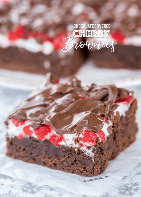 Chocolate Covered Cherry Brownies - seriously delicious!!! Homemade brownies topped with marshmallows, maraschino cherries and chocolate. Great for parties and a festive homemade holiday gift! I took these to a party and everyone asked for the recipe! SO good!!! Sugar, flour, cocoa, baking powder, salt, butter, eggs, marshmallows, maraschino cherries and chocolate chips. #brownies #christmasrecipes #dessertrecipe #dessert