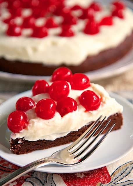 Chocolate Cherry Torte - brownie base topped with a whipped cream and mascarpone frosting. It is to-die-for! A real show stopper! Perfect for the holidays.