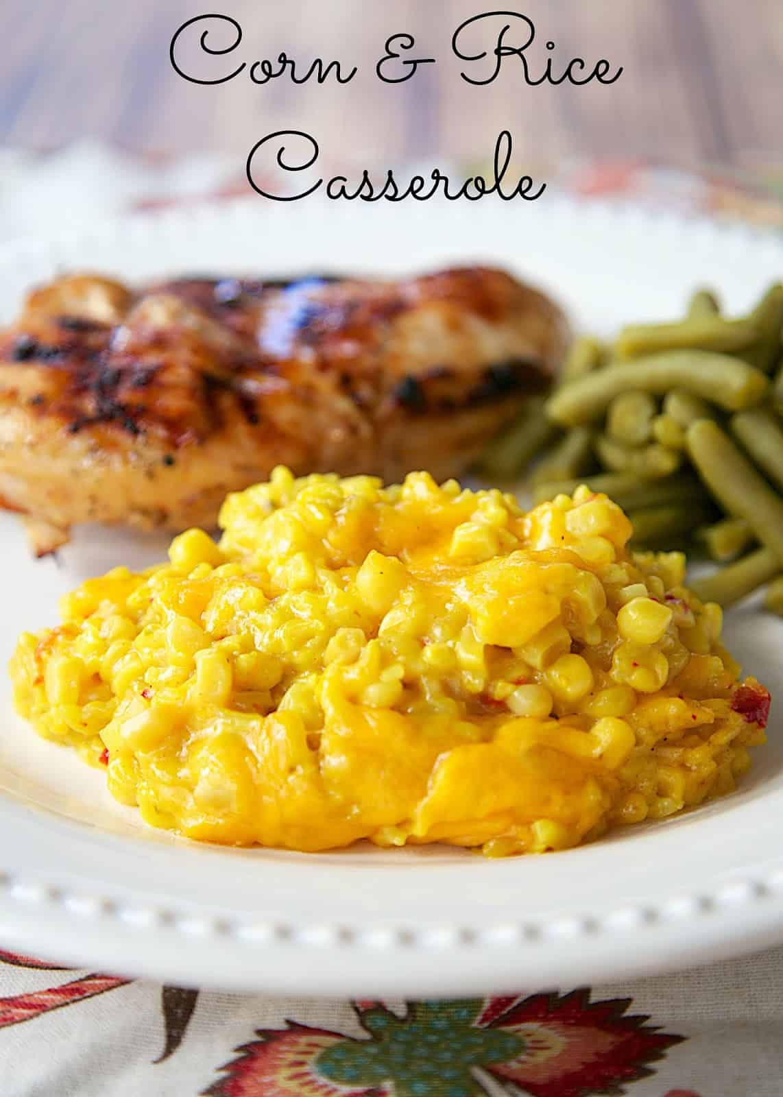 Corn and Rice Casserole - only 4 ingredients! Corn, Rice, Soup & Cheese. It is THE BEST corn casserole I've ever eaten! Can be made ahead of time. Quick side dish recipe!