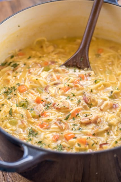Crack Chicken Noodle Soup - this soup should come with a warning label! SO GOOD!!! Ready in 30 minutes! Chicken, cheese soup, milk, chicken broth, celery, carrots, ranch mix, bacon, cheddar cheese and egg noodles. Everyone went back for seconds - even our super picky eaters! A great kid-friendly dinner!! We love this soup! #soup #bacon #chickennoodlesoup #crackchicken