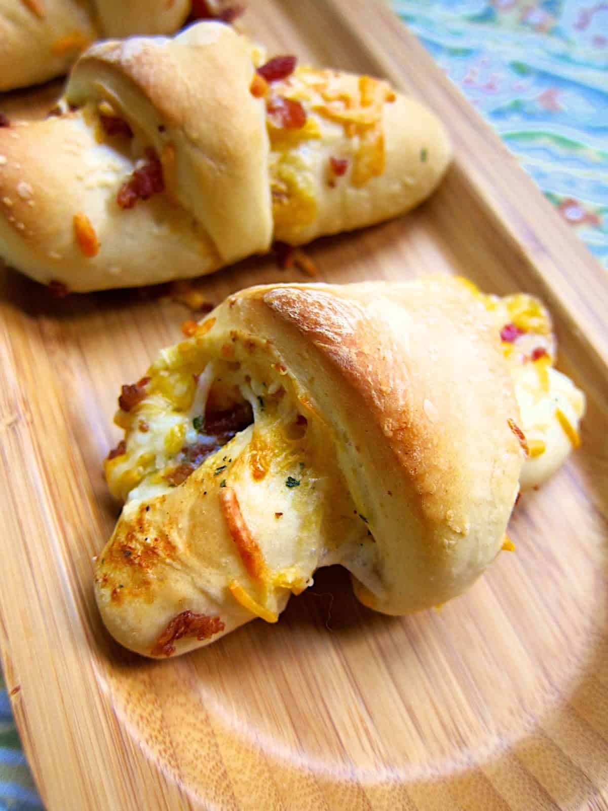 CRACK Crescents - Cheddar Bacon Ranch Crescents  - frozen rolls stuffed with cheddar, bacon and ranch! OMG! These are to-die-for!!! Great for breakfast, side dish or an appetizer!!! Only 5 ingredients in this easy bread recipe.