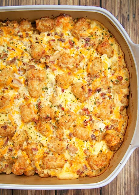 "Cracked Out" Chicken Tater Tot Casserole - You must make this ASAP! It is crazy good. Chicken, cheddar, bacon, ranch and tater tots.You can make it ahead of time and refrigerate it or even freeze it for later. I usually bake half and freeze half in a foil pan for later. Everyone gobbled this up! Even the super picky eaters.