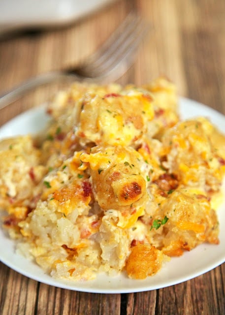 "Cracked Out" Tater Tot Casserole Recipe - easy Cheddar, Bacon and Ranch potato casserole using frozen tater tots. So simple and tastes amazing! The flavor combination is highly addictive!! Can freeze casserole for easy side dish later.