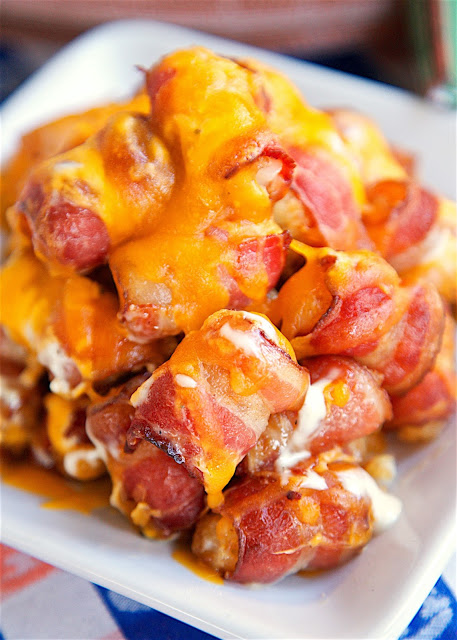 "Cracked Out" Tater Tot-Chos - Bacon wrapped tater tots topped with Ranch dressing and cheddar cheese. Only 4 ingredients and ready in about 30 minutes. OMG! This might be the best thing I've ever eaten! Seriously! These are gone in a flash! I never take home any leftovers.