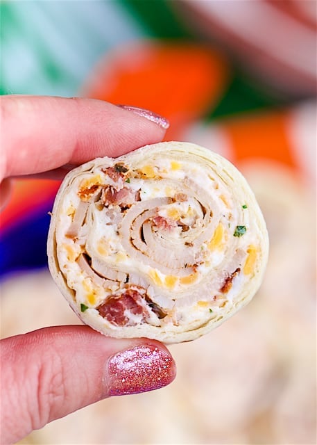 Cracked Out Turkey Pinwheels - I am ADDICTED to these sandwiches! Cream cheese, cheddar, bacon, Ranch and turkey wrapped in a tortilla. Can make ahead of time and refrigerate until ready to eat. Perfect for parties and tailgating!!