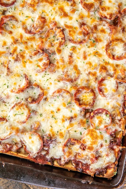 Crazy Crust Pizza - our new favorite pizza!! No rolling out dough - the crust is made from a liquid batter. Top the pizza with your favorite toppings. Flour, salt, Italian seasoning, eggs, milk, pepperoni, sausage, ham, pizza sauce and mozzarella cheese. We LOVE this pizza! We've been making it once a week for the past month. It is our go-to recipe!!