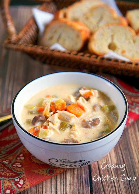 Creamy Chicken Soup Recipe - chicken, celery, carrots, mushrooms, chicken broth, cream of chicken soup, half-and-half and cheese! Can use rotisserie chicken for a super quick meal or boneless chicken breasts for an easy slow cooker meal. Freeze leftovers for a quick meal later!