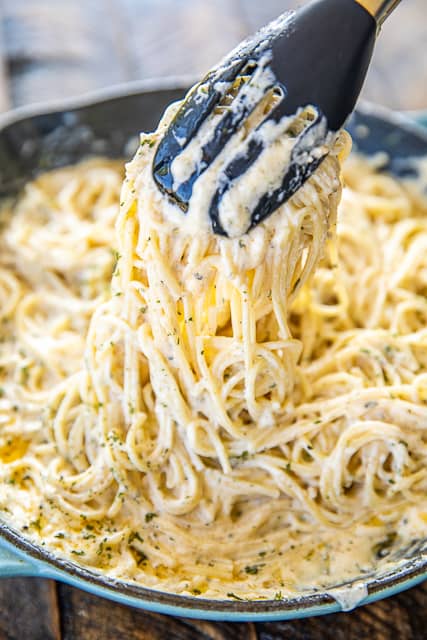 Creamy Noodles - a quick and easy side dish! Ready to eat in about 15 minutes! Spaghetti, cream cheese, milk, parmesan, garlic, butter, cajun seasoning, onion, and parsley. Goes with everything! Steak, chicken, pork. Great side dish or meatless main dish!