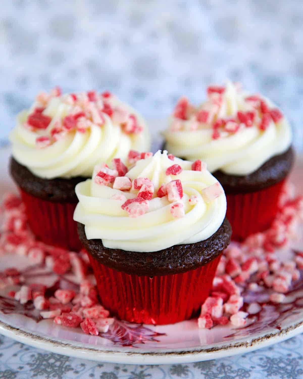 Peppermint Surprise Cupcakes - chocolate cupcakes with peppermint cake balls baked inside. Topped with homemade peppermint buttercream. The best cupcakes I've ever had!