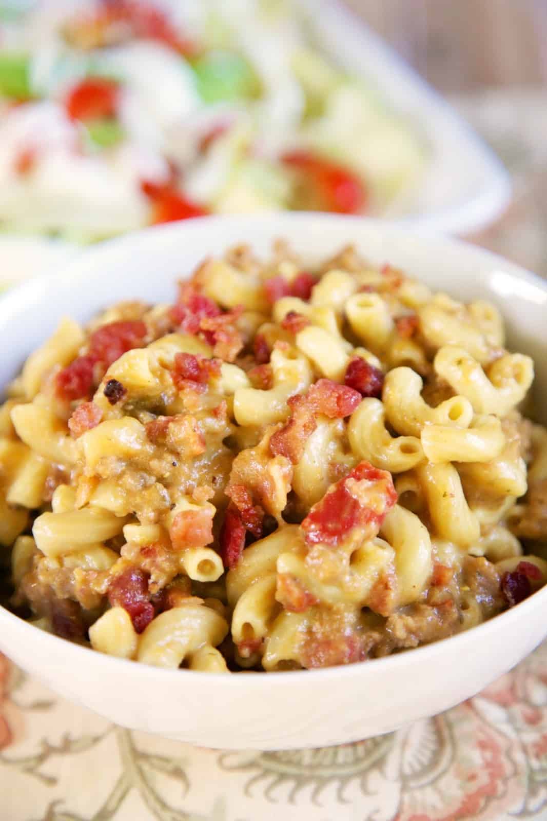 Slow Cooker Bacon Cheeseburger Pasta - FREEZER MEAL - just toss everything in a freezer bag for a quick meal later. Ground beef, bacon, onion, dry mustard, cream of chicken soup, Rotel tomatoes, beef broth, cheddar cheese and elbow macaroni. Kids go crazy over this easy slow cooker meal! No need to pre cook the ground beef or pre cook the pasta. It all cooks in the slow cooker. #slowcooker #freezermeal #groundbeef