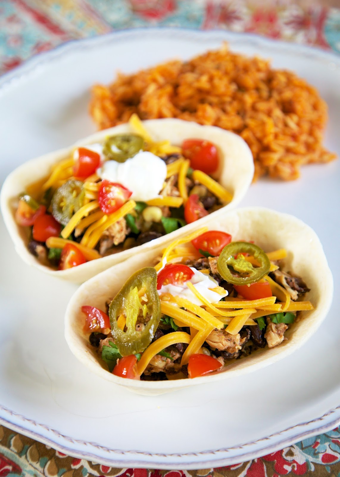 {Freezer Meal} BBQ Chicken Tacos Recipe - chicken, bbq seasoning, garlic seasoning, black beans, corn, tortillas. Throw everything in a freezer bag and freeze for later. Cook from frozen in the slow cooker.