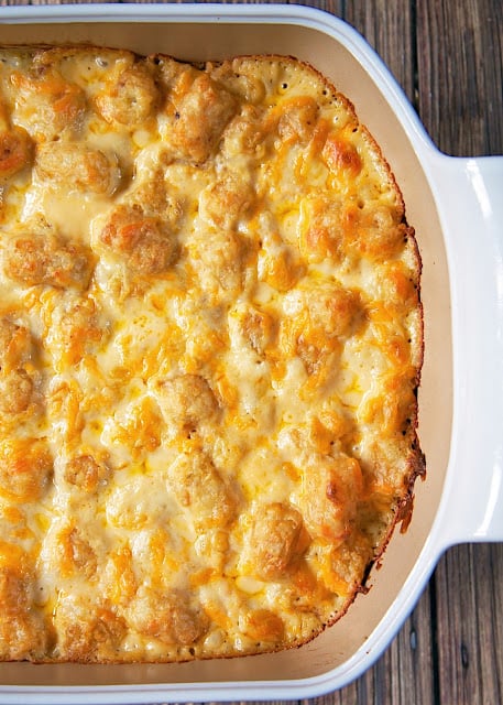 French Onion Tater Tot Casserole Recipe - tater tots, french onion dip, cream of chicken soup, cheese - LOVE this casserole! Can make ahead and freezer for later. You can even split it between two foil pans - one for now and one for the freezer. Super easy side dish with only 4 ingredients that tastes great!