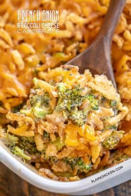 scooping broccoli casserole from baking dish