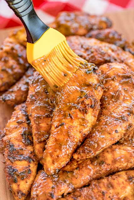 Georgia Gold BBQ Chicken - seriously delicious!!! Grilled chicken basted in a delicious homemade honey mustard bbq sauce. Yellow mustard, dijon mustard, cider vinegar, molasses, honey, butter, worcestershire sauce, garlic powder, black pepper, onion powder, cayenne pepper, oregano and seasoned salt. Can make BBQ sauce ahead of time and refrigerate until ready to cook chicken. This stuff is AMAZING! Perfect for you next cookout!! #grilling #bbqsauce #grilledchicken