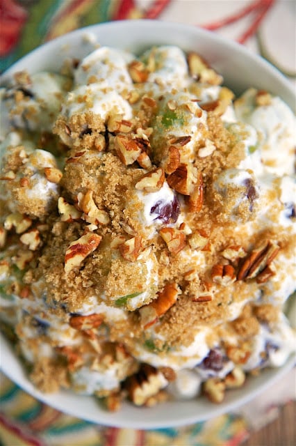Copycat Chicken Salad Chick Grape Salad -  this stuff is like crack. It is SO good! Cream cheese, sugar, vanilla, sour cream and grapes topped with brown sugar and pecans. Perfect for a crowd - brunch, baby shower, office potluck, cookout, tailgating, holiday breakfast. SO easy and CRAZY good! Can make ahead and refrigerate.