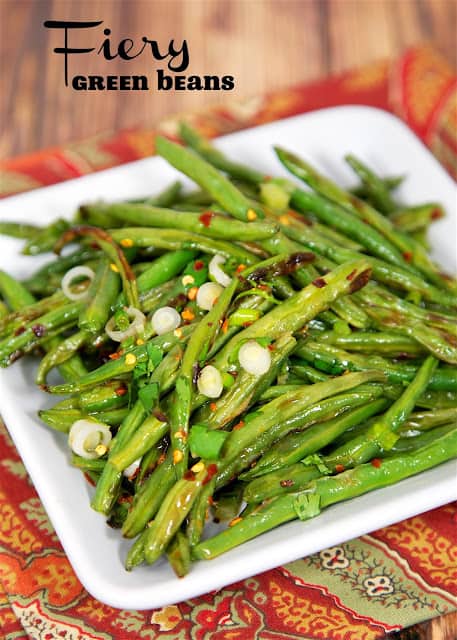 Fiery Green Beans - Ready in 15 minutes! Super easy weeknight side dish! Baked green beans tossed in lemon juice, cilantro, red pepper flakes and green onions. Tastes great warm or chilled. They actually taste better the longer they sit. SO good! Everyone gobbled these up!
