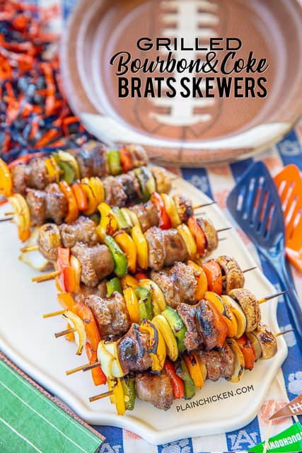 Grilled Bourbon & Coke Brats Skewers - SO good! Perfect party food!! Brats, onions, bell peppers and mushrooms marinated in bourbon, coke, soy sauce, brown sugar, seasoned salt and a little cayenne. Can assemble ahead of time and throw on the grill when you are ready to eat. These were a HUGE hit at our last tailgate. NO leftovers! A must for your next tailgate #tailgating #brats #grilling #partyfood