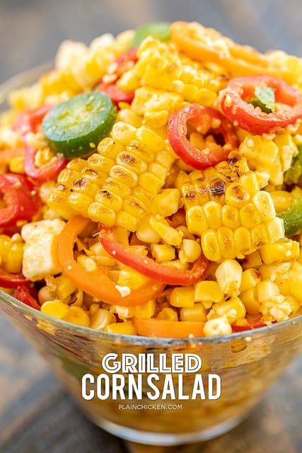 Grilled Corn Salad - simple and delicious side dish! Grilled corn, sweet peppers, jalapeños, feta cheese tossed in honey, lime, olive oil, garlic, and  cumin. Great with all your grilled dishes! Will keep in the refrigerator for several days. I made this for a cookout and it was gone in a flash!! YUM! #grilling #vegetable #sidedish #corn
