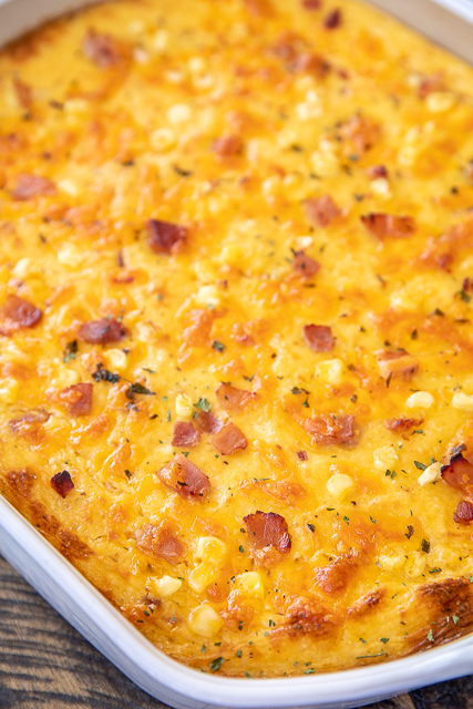 Ham and Corn Grits Casserole - seriously delicious! Great for breakfast, lunch or dinner!! Stone ground grits, chicken broth, ham, corn, cheddar cheese, milk, eggs, pepper and garlic. Can make ahead and refrigerate or freeze for later. Took this to a potluck and everyone asked for the recipe. DELICIOUS!!! #casserole #freezermeal #ham #breakfast #grits