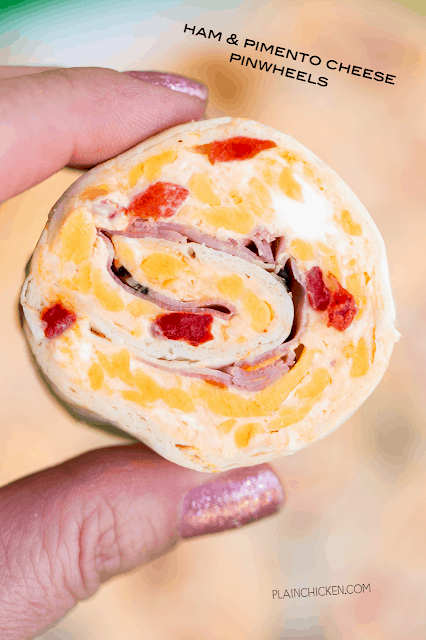 Ham & Pimento Cheese Pinwheels - I am ADDICTED to these sandwiches! Cream cheese, cheddar, parmesan cheese, garlic salt, pimentos, mayonnaise and ham wrapped in a tortilla. Can make ahead of time and refrigerate until ready to eat. Perfect for parties and tailgating!! A MUST for watching The Masters!