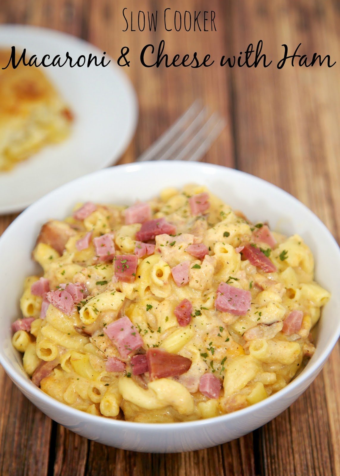Slow Cooker Macaroni & Cheese with Ham - great flavor and ready in 90 minutes. Can serve without ham as side dish. Macaroni, ham, milk, dijon mustard, onion powder, garlic powder, paprika, salt, pepper and cheddar cheese. Our FAVORITE mac and cheese recipe!!