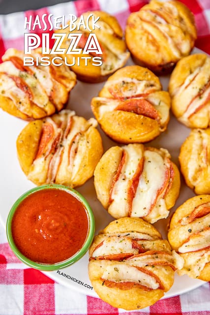 Hasselback Pizza Biscuits - a fun twist to pizza night!!! Refrigerated biscuits stuffed pepperoni and cheese and brushed with garlic butter. Dip in warm pizza sauce. SO good! Great for parties, lunch, dinner, or afternoon snack. SO easy to make and everyone LOVES them!! #pizza #pepperoni 