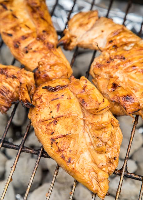 Honey Lime Sriracha Chicken Recipe - chicken marinated in honey, soy sauce, Worcestershire, garlic, lime and Sriracha - Let the chicken marinate for at least 4 hours and then grill to perfection. Sweet with a little heat! One of our favorite grilled chicken recipes!