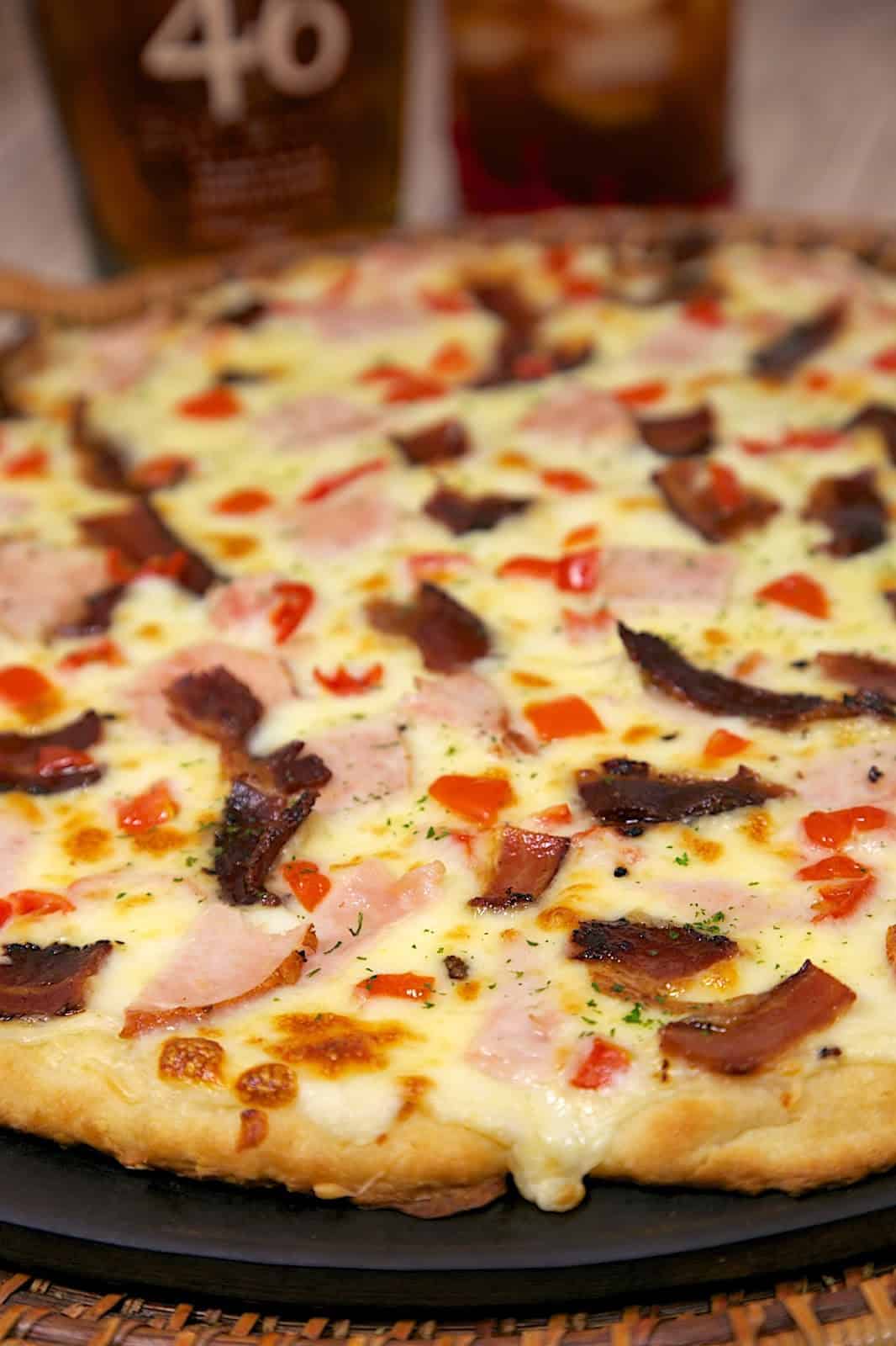 Hot Brown Pizza Recipe - mornay sauce(swiss cheese sauce), turkey, tomatoes, bacon, swiss and mozzarella cheese - perfect for watching the Kentucky Derby!