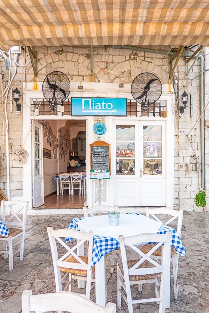 cafe in front of the clock tower Hydra Greece