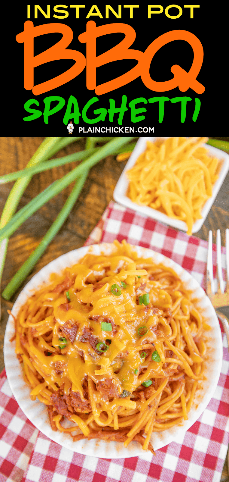 bbq spaghetti topped with cheese and onions on a plate