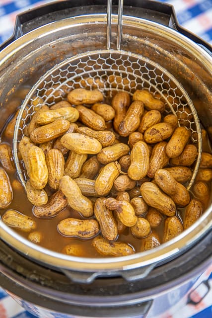 Instant Pot Boiled Peanuts - ready to eat in under an hour!! We love these boiled peanuts for tailgating. SO easy to make! Season with cajun seasoning, old bay or salt. Store leftovers in the refrigerator for up to 10 days. #instantpot #tailgating #peanuts #boiledpeanuts