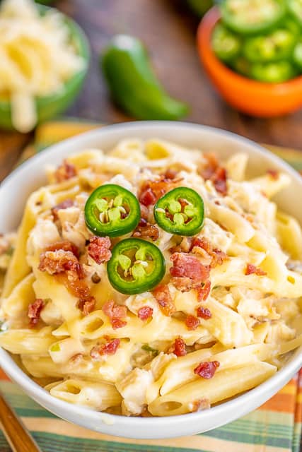 Instant Pot Chicken Jalapeño Popper Pasta - creamy chicken pasta loaded with bacon, jalapeños and pepper jack cheese! Seriously delicious! 4 minutes of cook time. We ate this two days in a row. Chicken, jalapeños, bacon, garlic, onion, chicken broth, water, cream cheese, penne pasta and pepper jack cheese. Everyone cleaned their plate! Even our picky eaters!! #chicken #InstantPot #pasta