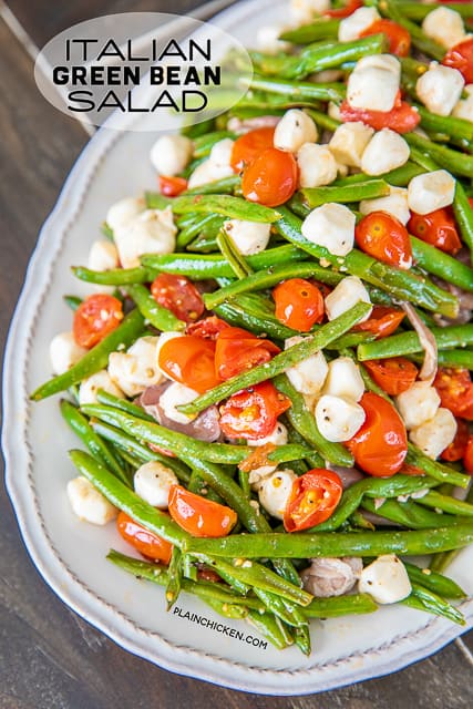 Italian Green Bean Salad - quick and delicious side dish! Green beans, tomatoes, garlic, olive oil, prosciutto, and mozzarella tossed in lemon juice and olive oil. Can serve hot or cold. Great for potlucks and cookouts. Can make in advance and refrigerate until ready to serve. Everyone always asks for the recipe! YUM! #salad #greenbeans #vegetable