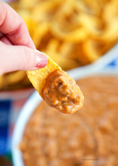Killer Bean Dip - only 5 ingredients! Refried beans, hamburger, taco seasoning, salsa and Velveeta. Can make on the stove or in the slow cooker. This stuff is CRAZY good! Great for tailgating!! I could make a meal out of this dip. Great Mexican dip!!
