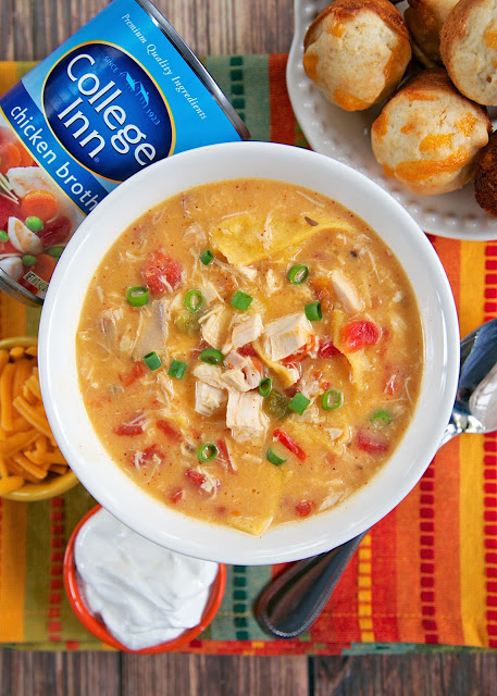 King Ranch Chicken Soup - THE BEST soup I've ever made! All the flavors of King Ranch Casserole in soup form. Rotisserie chicken (or leftover turkey), cream of chicken, cream of mushroom, Rotel tomatoes, spices, College Inn chicken broth, Velveeta and tortillas. Ready in under 30 minutes. Can also make in slow cooker.