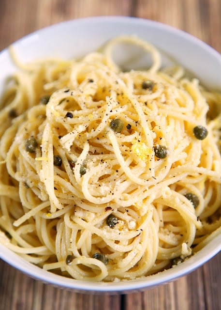 Lemony Pasta with Garlic and Capers recipe - quick pasta dish tossed with olive oil, lemon, garlic, capers and parmesan - seriously delicious! Quick!! Ready in 15 minutes! Can be a side dish or a meatless main dish. We couldn't' stop eating this yummy pasta!