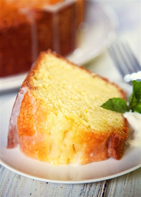 Lemon Sour Cream Pound Cake - the most AMAZING pound cake I've ever eaten! So easy and delicious! Top the cake with a lemon glaze for more yummy lemon flavor. Serve the cake with whipped cream, mint and fresh berries. I took this to a party and everyone asked for the recipe!
