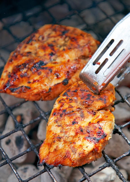 Lexington Grilled Chicken - sweet and tangy grilled chicken! Only 6 ingredients in the marinade - cider vinegar, brown sugar, oil, red pepper flakes, salt and pepper - Perfect for a cookout! Everyone raves about this chicken. There are never any leftovers!!