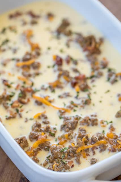 Low Carb Bacon Cheeseburger Casserole - low on carbs but high on taste! SO good! Everyone cleaned their plate and asked for seconds!! Ground beef, bacon, ketchup, mustard, onion, Ranch, cheddar cheese, eggs, milk and sour cream. It is like a quiche without the crust. Ready in 30 minutes. Can make ahead and refrigerate or freeze for later. #casserole #freezermeal