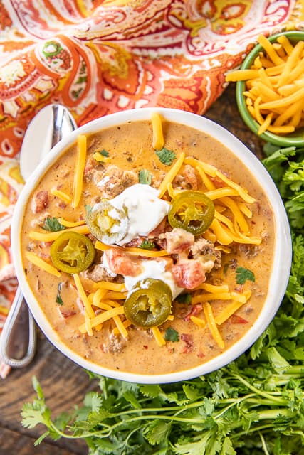Low-Carb Taco Soup - SO good! I wanted to lick the bowl!! If you aren't doing low-carb, feel free to add corn and black beans. Ground beef, taco seasoning, Ranch dressing mix, diced tomatoes and green chilies, cream cheese, Velveeta, beef broth. Just dump every in the crock pot and dinner is done. Can freeze leftovers for a quick meal later. This soup is seriously delicious!! #crockpot #slowcooker #soup #taco #lowcarb