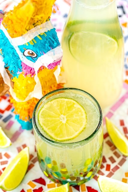 Margarita Punch - great for a crowd! SO easy to make and tastes great! Limeade, Lemonade, orange extract, Sprite, water and tequila. Can leave out the tequila for a virgin margarita punch! Great for Cinco de Mayo, dinner parties and tailgating!