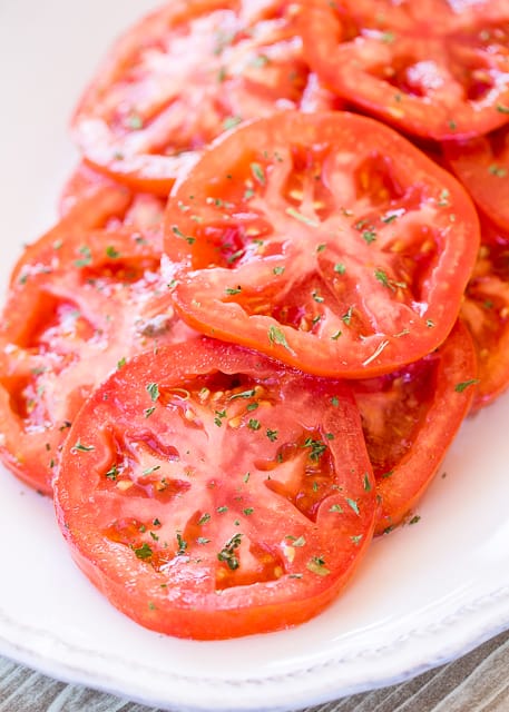 Greek Marinated Tomatoes - only 2 ingredients! Great way to use up all those yummy ripe tomatoes. Great as a side dish or on a sandwich! These make THE BEST BLT sandwich EVER! Whip up a batch today! Such an easy side dish recipe.