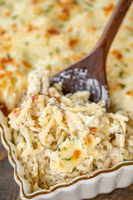 Million Dollar Chicken Alfredo - seriously delicious! Chicken, pasta, alfredo sauce and 4 cheeses! The BEST chicken alfredo EVER!!! Can make ahead and refrigerate or freeze for later. Spaghetti, cream cheese, sour cream, cottage cheese, chicken, Alfredo sauce, parmesan cheese and mozzarella cheese. Serve with a simple salad and garlic bread. Great for dinner parties and potlucks! Everyone loves this easy casserole! I never have any leftovers!! #casserole #chickencasserole #pasta #freezermeal