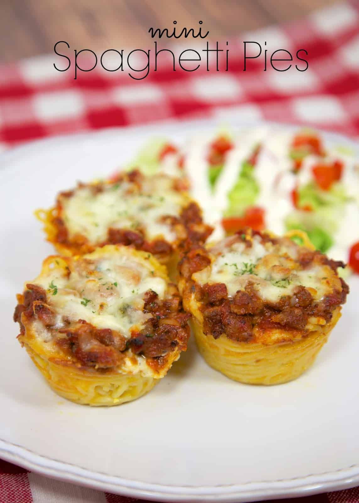 Mini Spaghetti Pies Recipe - individual spaghetti pies baked in a muffin tin. Can freeze leftovers for a quick meal later. Since they are small, they reheat in a flash! Our new favorite way to eat spaghetti!